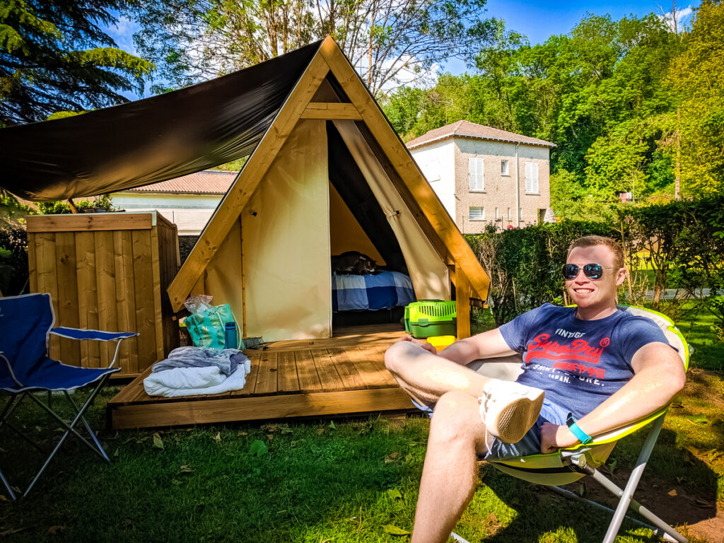 Mike lovatt sat outside our tente randonneur at Camping des Ribières