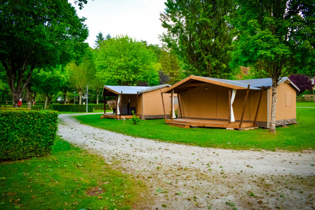 Outside of a tente cotton at Camping des Ribières