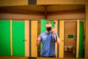 mike taking a selfie in saint avit loisirs toilet block