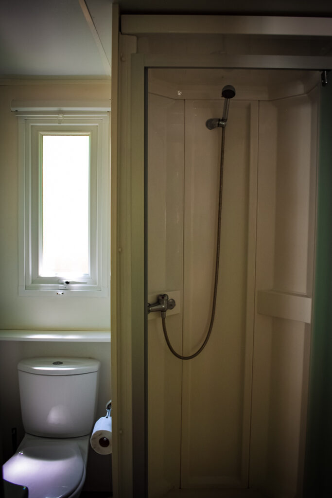 shower cubicle and toilet in portrait style photo of the bathroom in the Azure plus formerly known as the avant mobile home by eurocamp