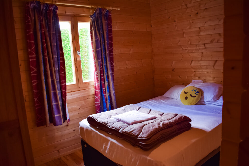 downstairs double bedroom in the wooden 4 bed villa lodge from eurocamp at la croix du vieux pont berny riviere