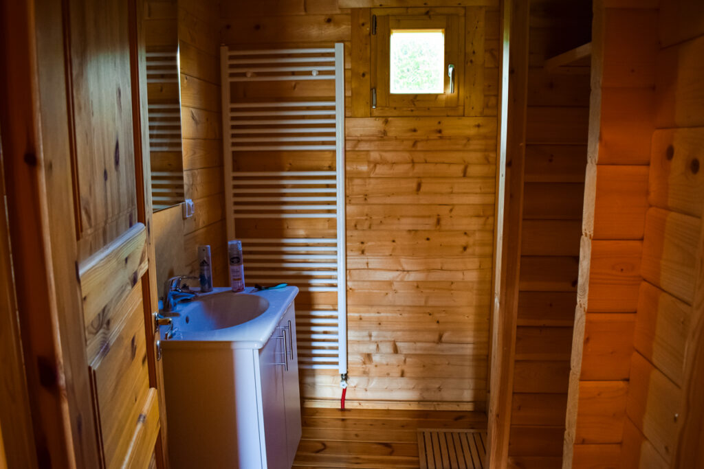 downstairs shower room with walk in shower in the 4 bedroom wooden lodge from eurocamp at la croix du vieux pont berny riviere campsite