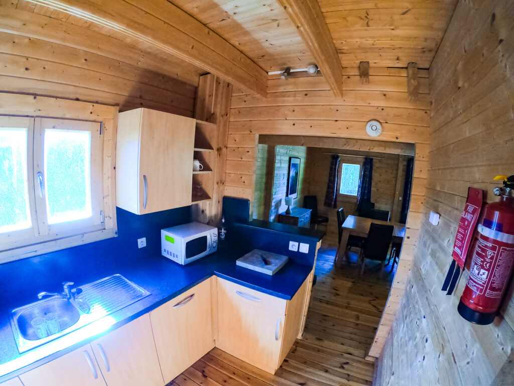 GO pro fish eye photo from inside the kitchen in the 4 bedroom wooden villa lodge at la croix du view pont camping