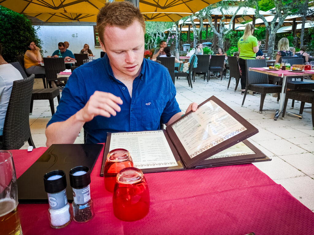 Mike reading the menu at sequoia parc campsite