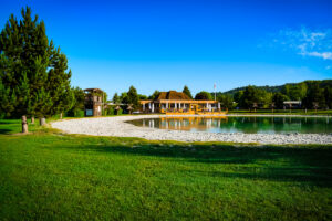 The beach lake with beach bar called la plage in the background at La Croix du vieux pont berny riviere france (28)