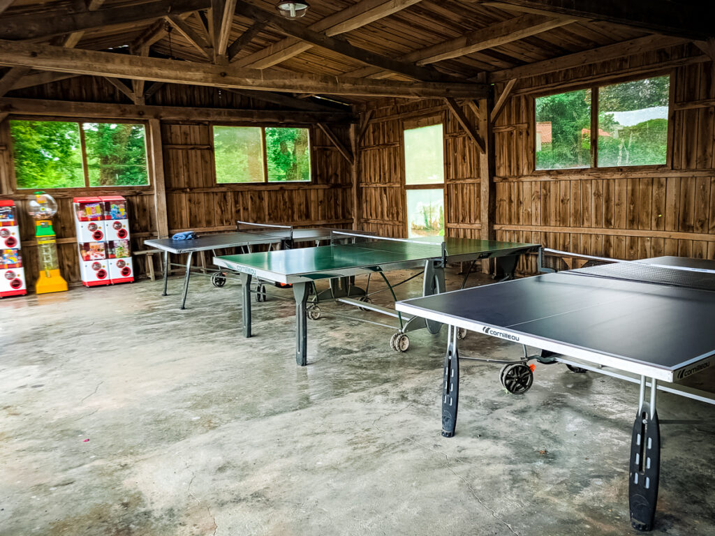 inside table tennis under bike shed cover at castels camping la garangeoire