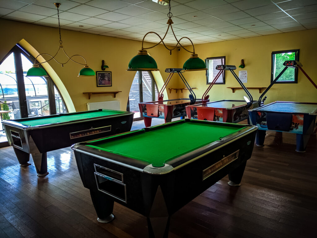 pool or billiards and mini arcade with air hockey upstairs in the summer bar at camping La Croix du vieux pont berny riviere france (49)