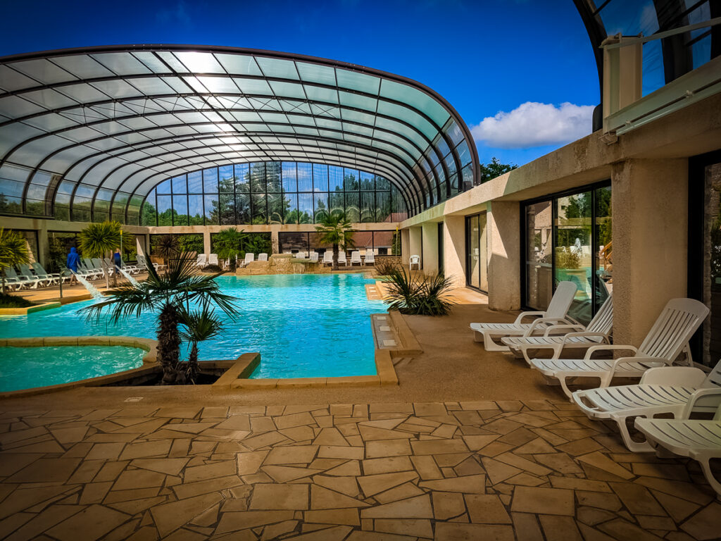 the indoor pool area with retractable roof at La Croix du vieux pont berny riviere france (63)