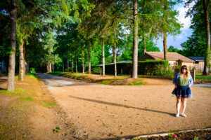 the main driveway at camping la garangeoire with Breanne stood on it