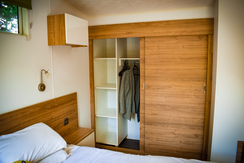 sliding doors storage space wardrobes in the aspect mobile home by eurocamp