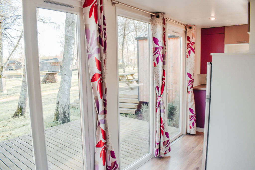 Cottage loupiac open patio windows at the camping lac du bordeaux campsite