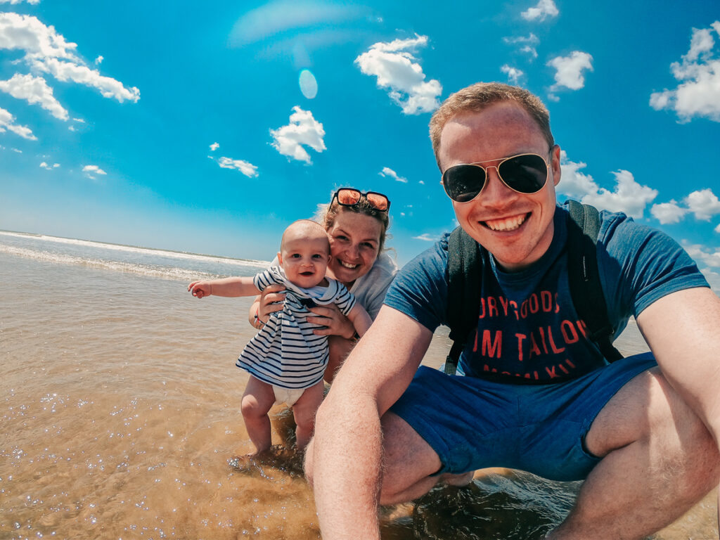 Breanne Mike and baby on the beach while camping in Brem Sur Mer