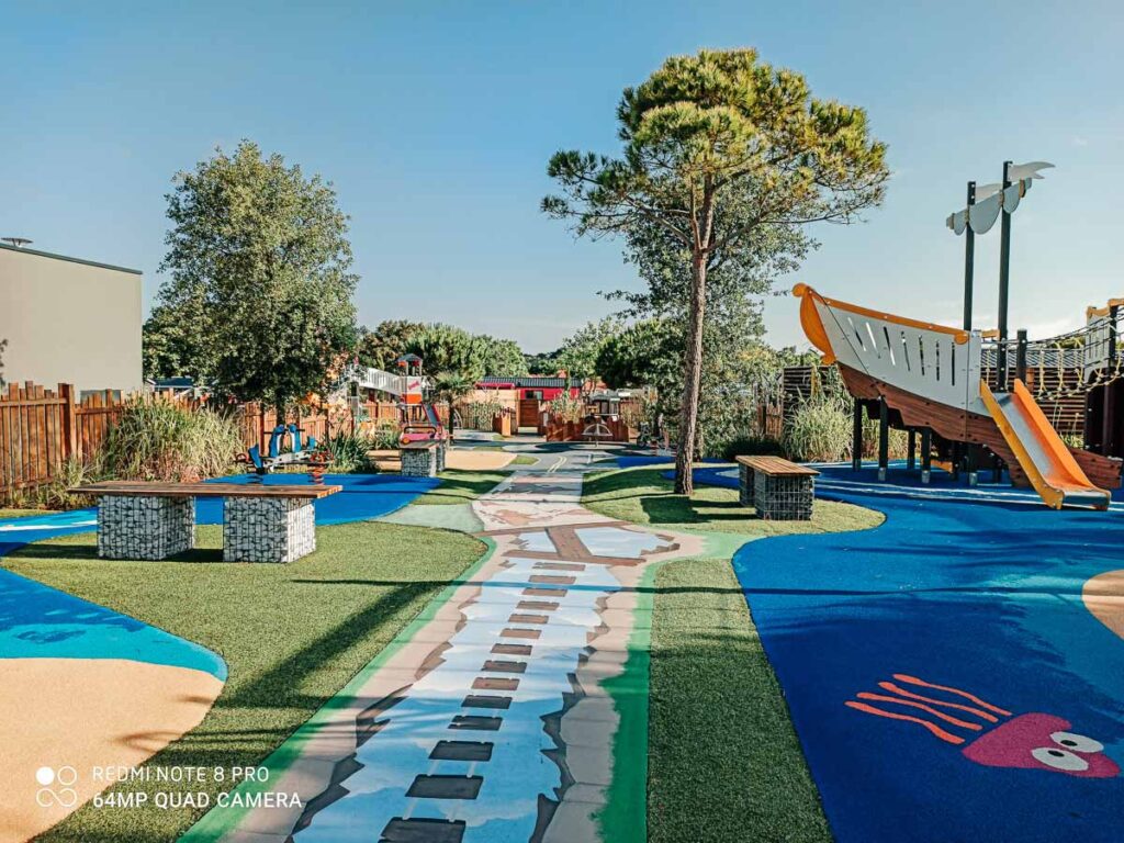 new outdoor play area with fun coloured and patterned floor at Camping de l'ocean Brem Sur Mer