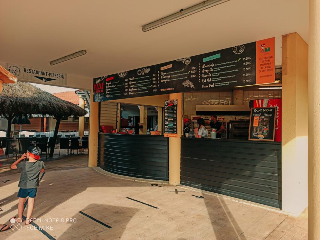 The pizza stall and menu list at camping le vieux port by Resasol in Messanges, Landes department, France