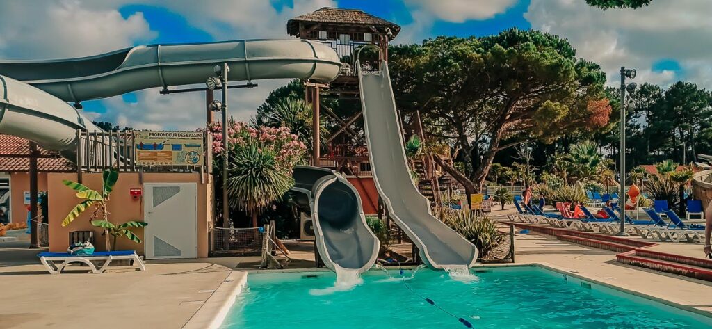 waterslide exit pool at The pool area at camping le vieux port by Resasol in Messanges, Landes department, France