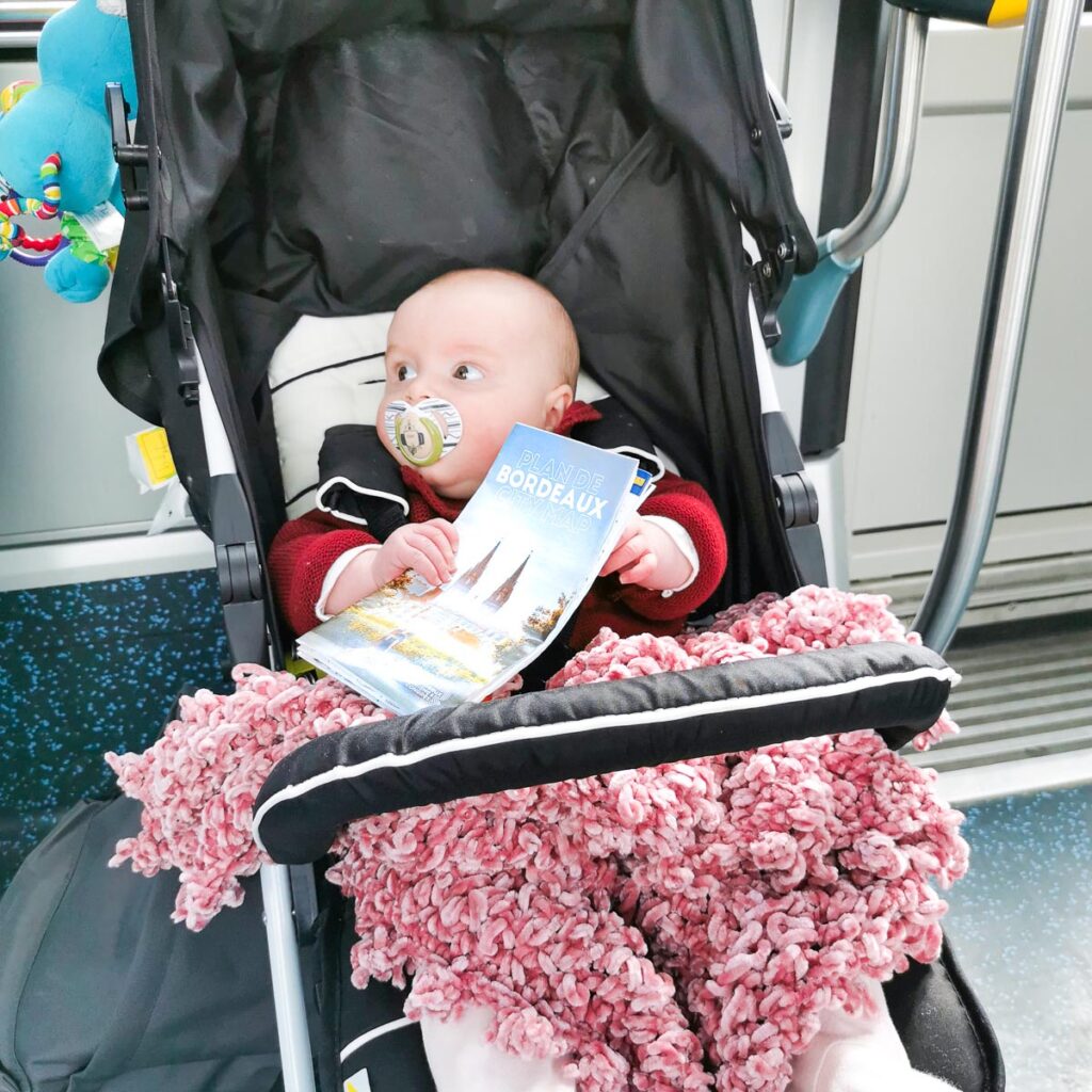 Baby with her Bordeaux flyer at Yelloh Village Camping Bordeaux Lac (64)