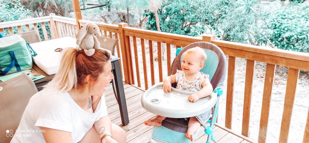 Breanne and baby outside playing with flopsy bunny premium cottage at camping natureo in hossegor-27