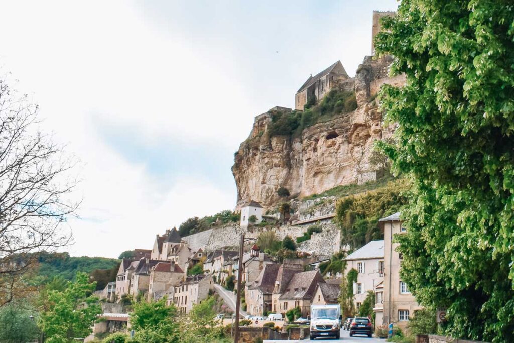 Castle on the hill in beynac et cazenac in the dordogne to show the landscape of the village