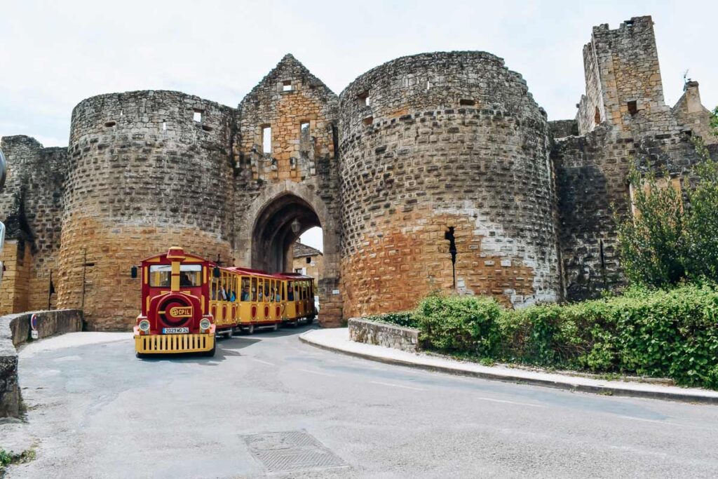 A photo of a tourist train in the dordogne village of Domme