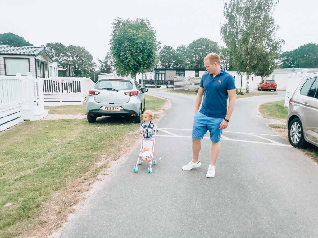 Mike-and-the-toddler-walking-down-the-road-at-Hoburne-bashley-holiday-park