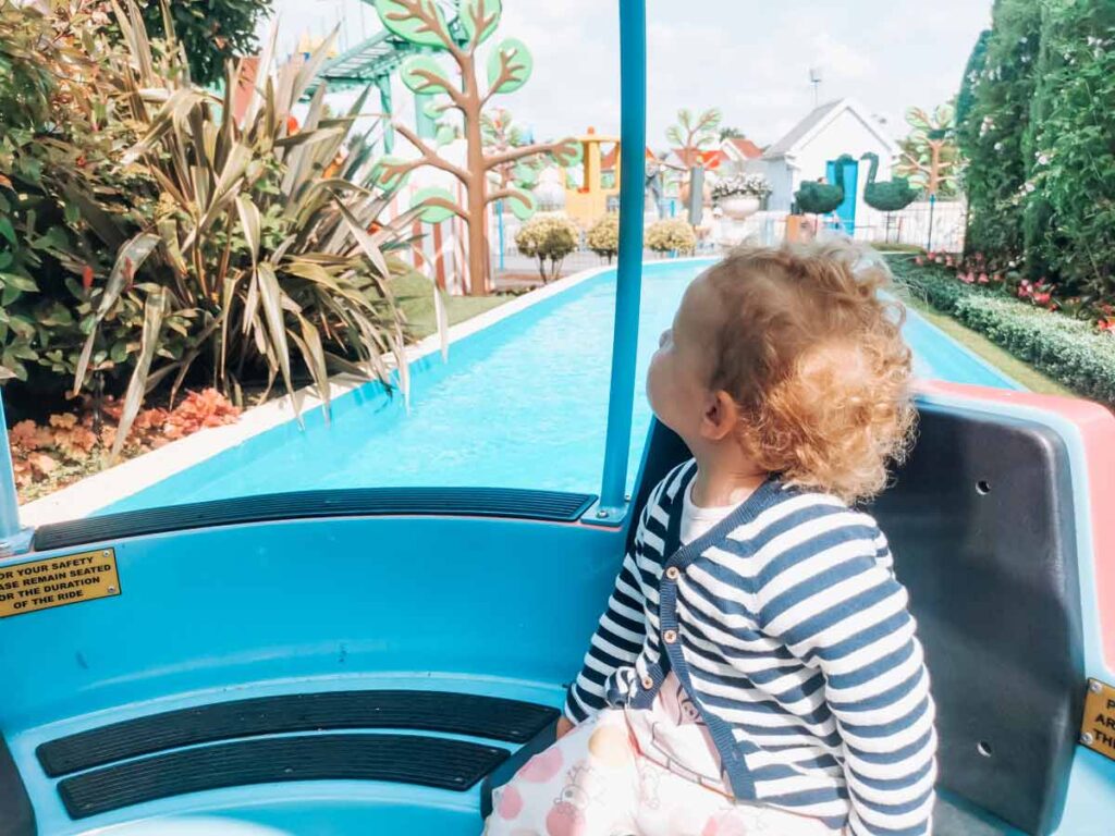 toddler on the grandpa pig ride at Paultons-park-and-peppa-pig-world