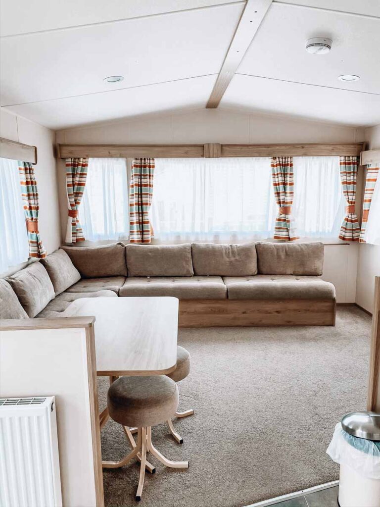 seating-area-with-windows-in-a-classic-caravan-at-hoburne-bashley-holiday-park