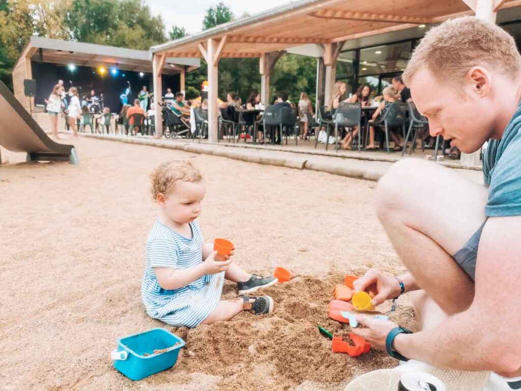 Mike and the toddler digging in the play sant at camping la roche posay