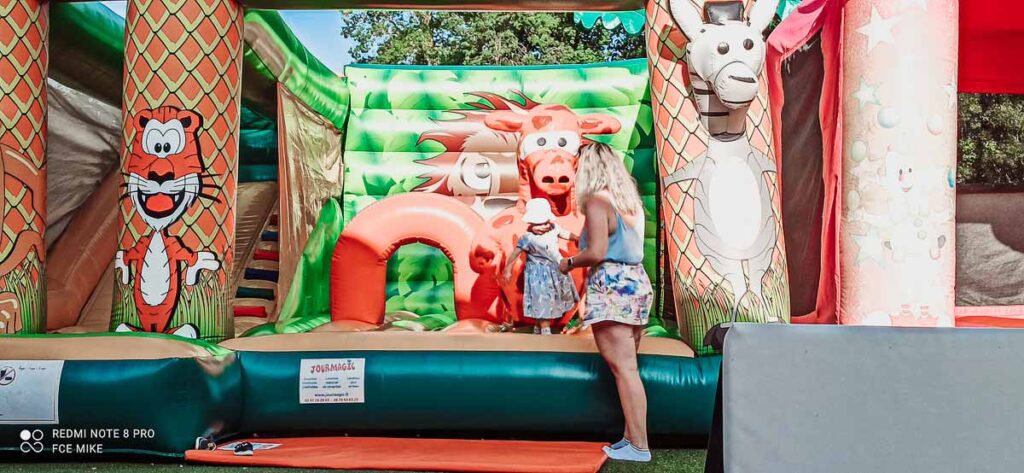 toddler-on-a-bouncy castle-at-domaine-de-la-breche-campsite