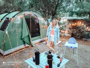 breanne-stood-outside-our-skandika-5-green-tent-with-lots-of-lights-at-sylvamar-campsite