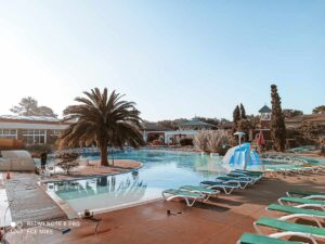 swimming-pool-view-with-man-cleaning-it-early-in-the-morning-at-sylvamar-campsite