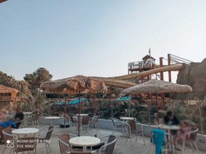 Landscape view of the waterslides from the bar area at camping sylvamar yelloh village campsite
