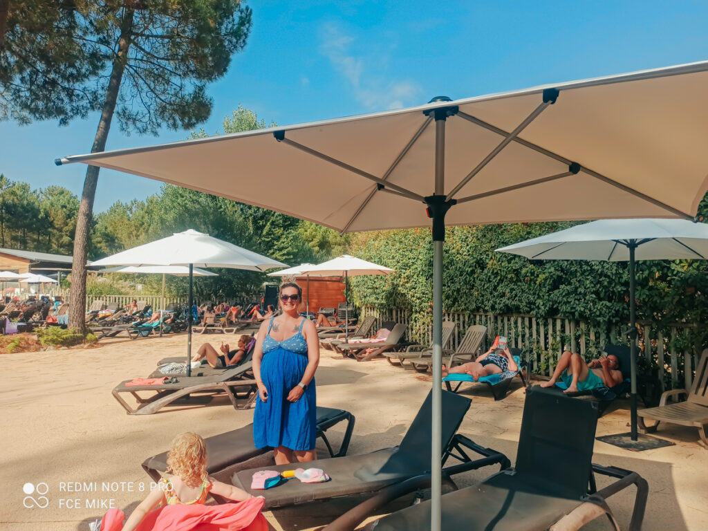 sun loungers around a poolside at sandaya soustons village campsite -21