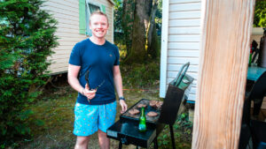 mike cooking a bbq outside our mobile home