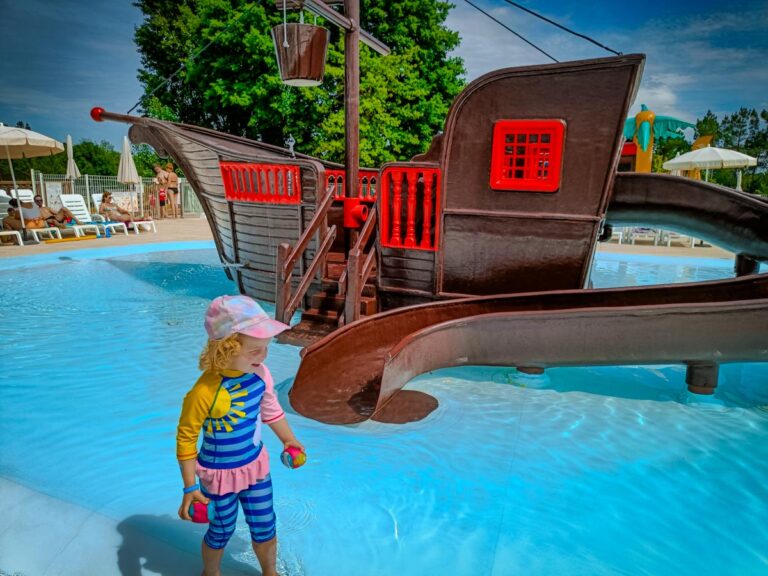 A child on a pirate ship splash pad slide at Sandaya Le Grand Dague