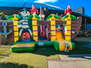 bouncy castl outside of pool area at des ormes