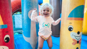 toddler on a bouncy castle at les ormes resort