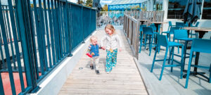 children walking down wheelchair ramp at clarys plage campsite
