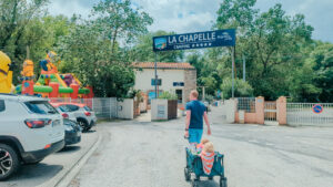 pulling the trolley to the campsite entrance at la chapelle marvilla park