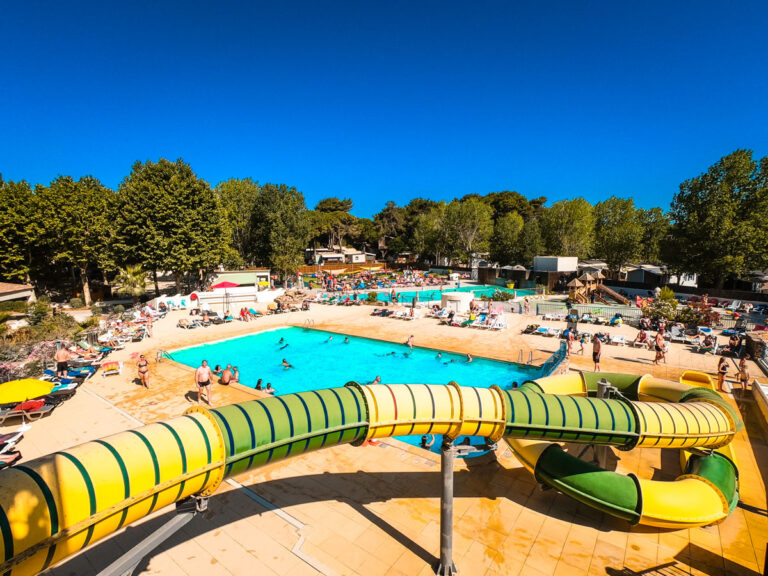 Water slides looping over a pool at Domaine La Yole