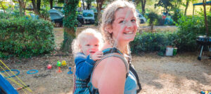 Baby in a baby carrier on Le Lac des 3 Vallées