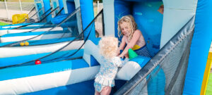 children playing in the bouncy castle park at Le Lac des 3 Vallées