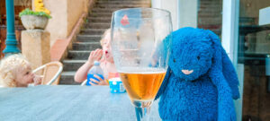 jellycat bunny drinking beer at Le Lac des 3 Vallées