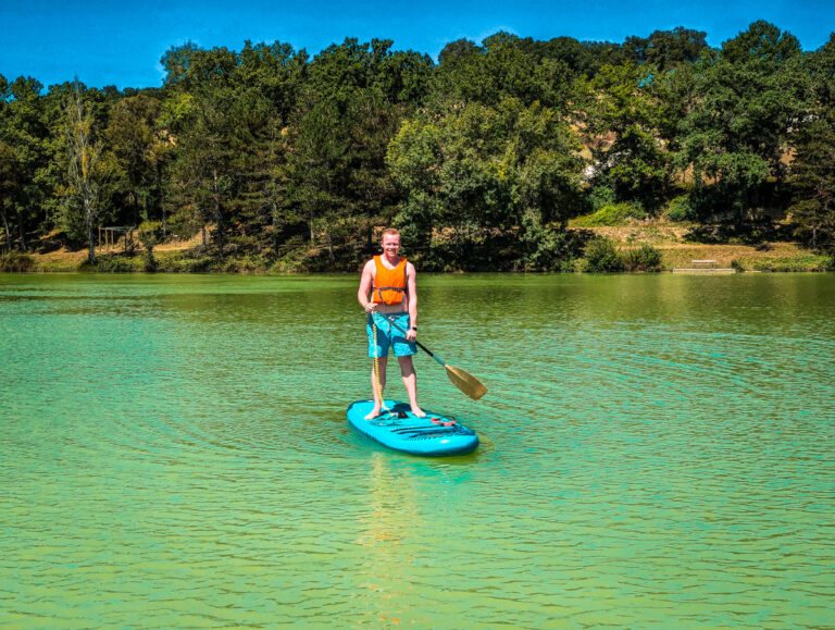 Mike on a paddleboard at Le Lac des 3 Vallées