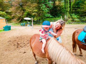 Baby sat on a pony
