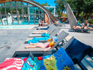 sun loungers around the pool at ranc davaine campsite