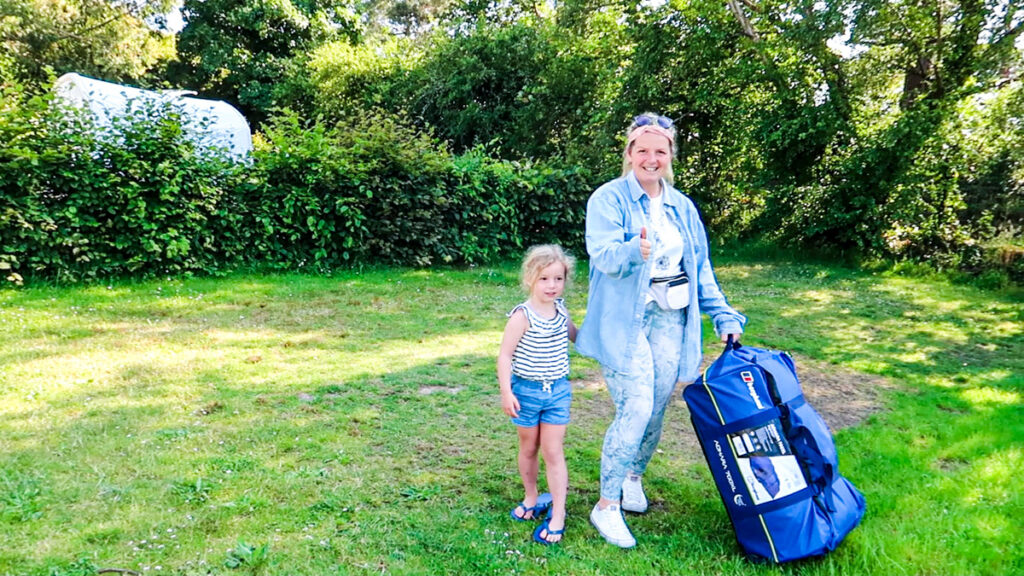 standing with the berghaus adhara 700xl tent in a bag with my 5 year old