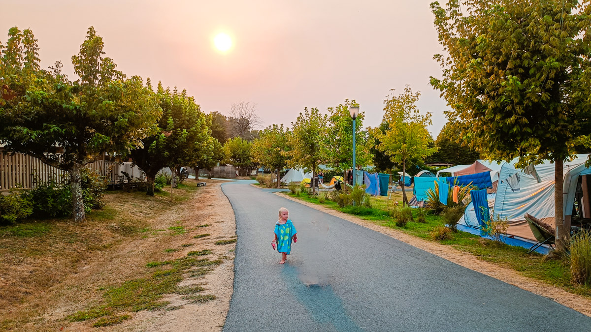 walking down the road at pomport beach campsite at sunset