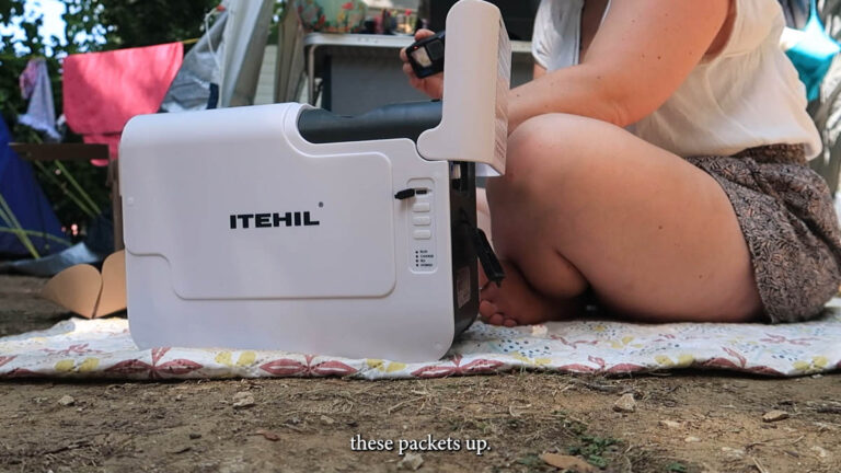 ITEHIL portable water filter being used from a car boot