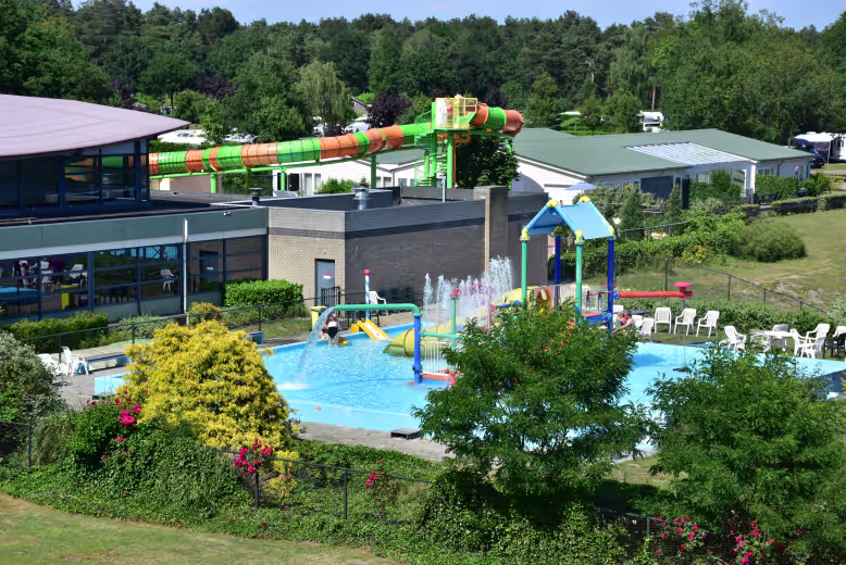 eurocamp netherlands site de schatberg birds eye view of swimming pool and waterslide coming out of a building
