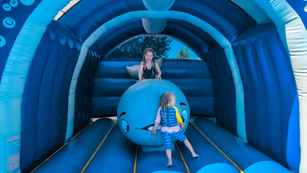 Bouncy castle inside Camping Bel pool area